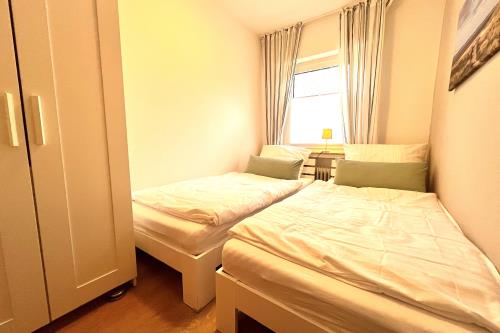 Langeoog Ferienwohnung Us Langeoog - An den Hellerwiesen - An den Hellerwiesen Schlafzimmer