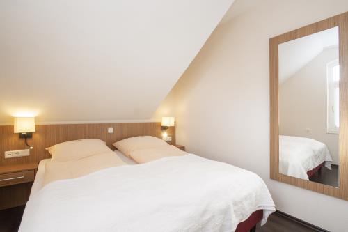 Langeoog Ferienwohnung Appartementhaus Alte Post - 20 - App 20 Schlafbereich