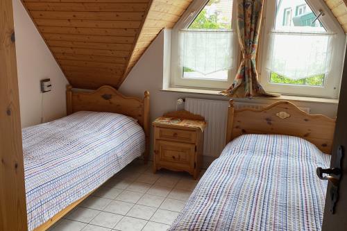 Langeoog Ferienhaus Haus Bornefeld - Schlafzimmer 2 Einzelbetten
