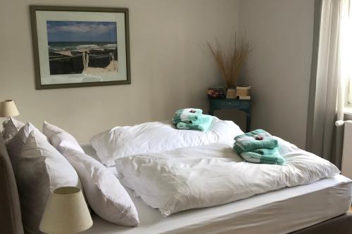 Langeoog Ferienwohnung De Fischer un sien Froo - Blumental - Schlafzimmer mit Morgensonne