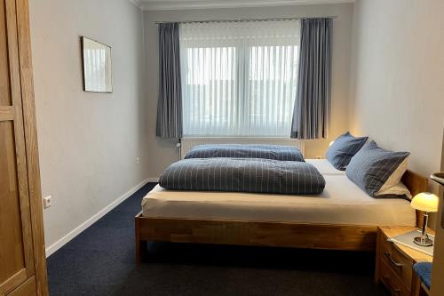 Langeoog Ferienwohnung Ferienhaus Sülvern Wind - Schlafzimmer 1