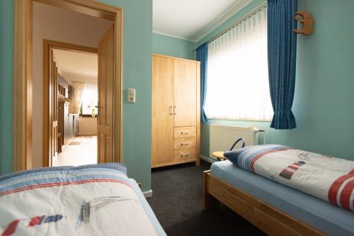 Langeoog Ferienwohnung Ferienhaus Sülvern Wind - Schlafzimmer