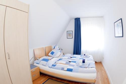 Langeoog Ferienwohnung Fylgja - Schlafzimmer mit Doppelbett