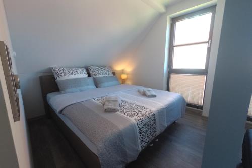 Langeoog Ferienwohnung Haus Kalmar - Wohnung Osterhook - Osterhook Boxspringbett