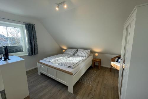 Langeoog Ferienwohnung Haus Janssen - 5 - Schlafzimmer