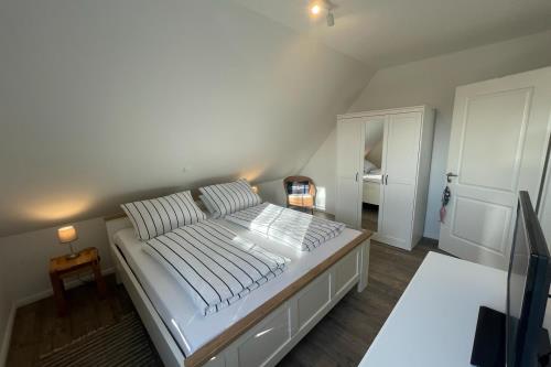 Langeoog Ferienwohnung Haus Janssen - 5 - Schlafzimmer