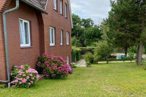 Langeoog Ferienwohnung Haus Numrich - Seitliche Hausansicht