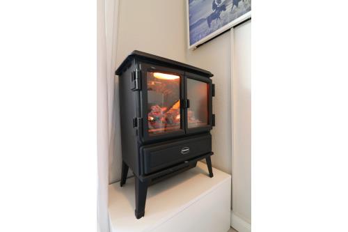 Langeoog Ferienwohnung Vermietung am Meer – Langeooger Viermaster - Grünes Segel - Kaminofen