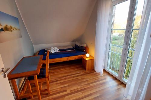 Langeoog Ferienhaus Residenz Inseltraum (Doppelhaushälfte) - Einzelzimmer OG mit TV und DVD