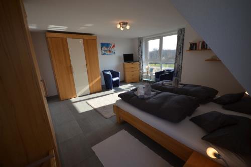 Langeoog Ferienhaus Residenz Süderdünenring FH***** - Dorada - Haus Dorada - Doppelschlafzimmer, 1. OG