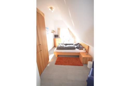 Langeoog Ferienhaus Residenz Süderdünenring FH***** - Dorada - Haus Dorada - Doppelschlafzimmer, 2. OG
