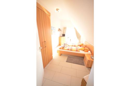 Langeoog Ferienhaus Residenz Süderdünenring FH***** - Merluza - Haus Merluza - Doppelschlafzimmer, 2.OG