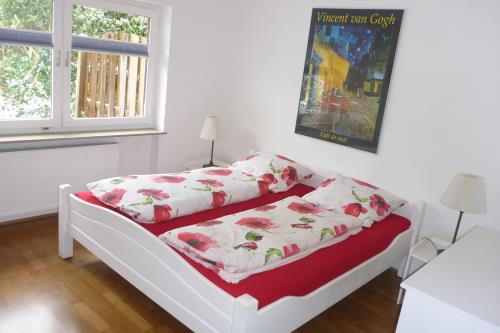 Langeoog Ferienhaus Schimmelreiter - Schlafzimmer mit echtem Eiche-Parkett