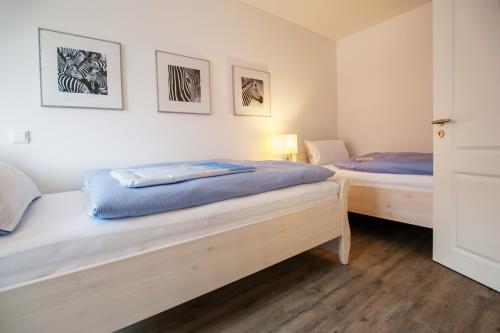 Langeoog Ferienhaus Strandvillen Langeoog - Hus in Lee - Hus in Lee, 1. OG: Zweibettzimmer