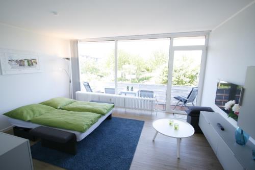 Langeoog Ferienwohnung Us Langeoog - Barkhausenstraße - Mey - Mey Wohnzimmer/Schlafmöglichkeit