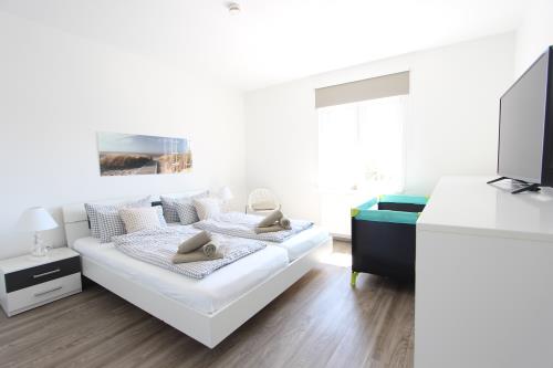 Langeoog Ferienwohnung Us Langeoog - Haus Stefanie - Stefanie 1 - 2 Schlafzimmer OG mit Doppelbett