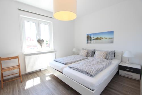 Langeoog Ferienwohnung Us Langeoog - Haus Stefanie - Stefanie 1 - 3 Schlafzimmer OG mit Boppelbett