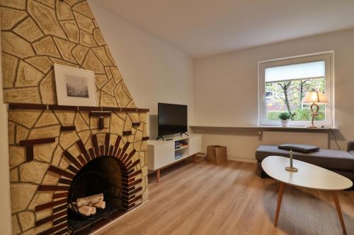 Langeoog Ferienwohnung Vermietung am Meer – Haus Seedüvel - Seedüvel EG - Wohnzimmer